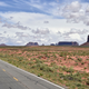 A photo of a highway passing through Monument Valley in Utah.